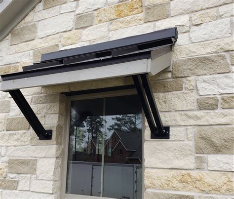 awning metal roof brackets over garage|camelback awning brackets.